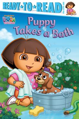 Puppy takes a bath cover image