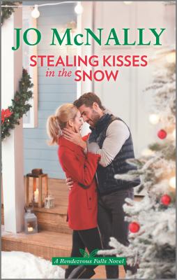 Stealing kisses in the snow cover image