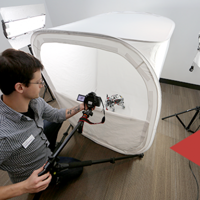 Image of staff setting up photo equipment