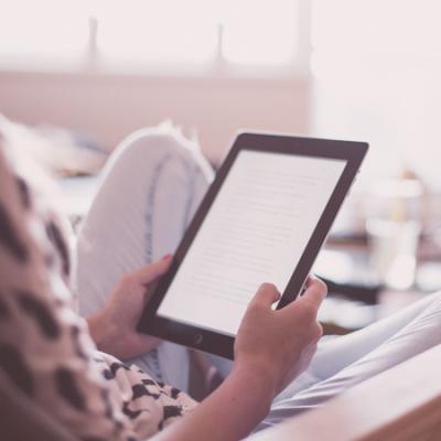 person holding an iPad tablet