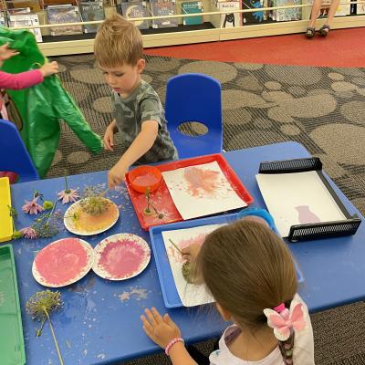 Kids painting in Kids' World during Play Time.