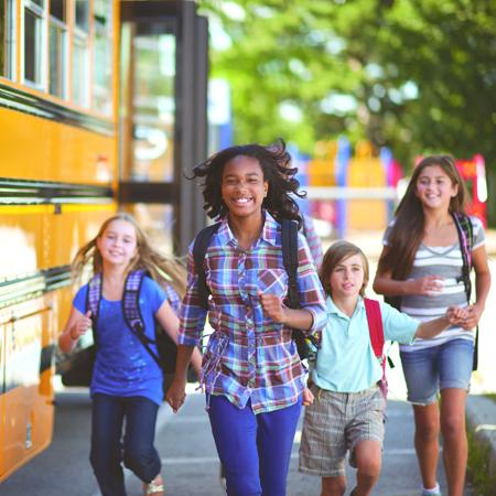 kids getting off school bus